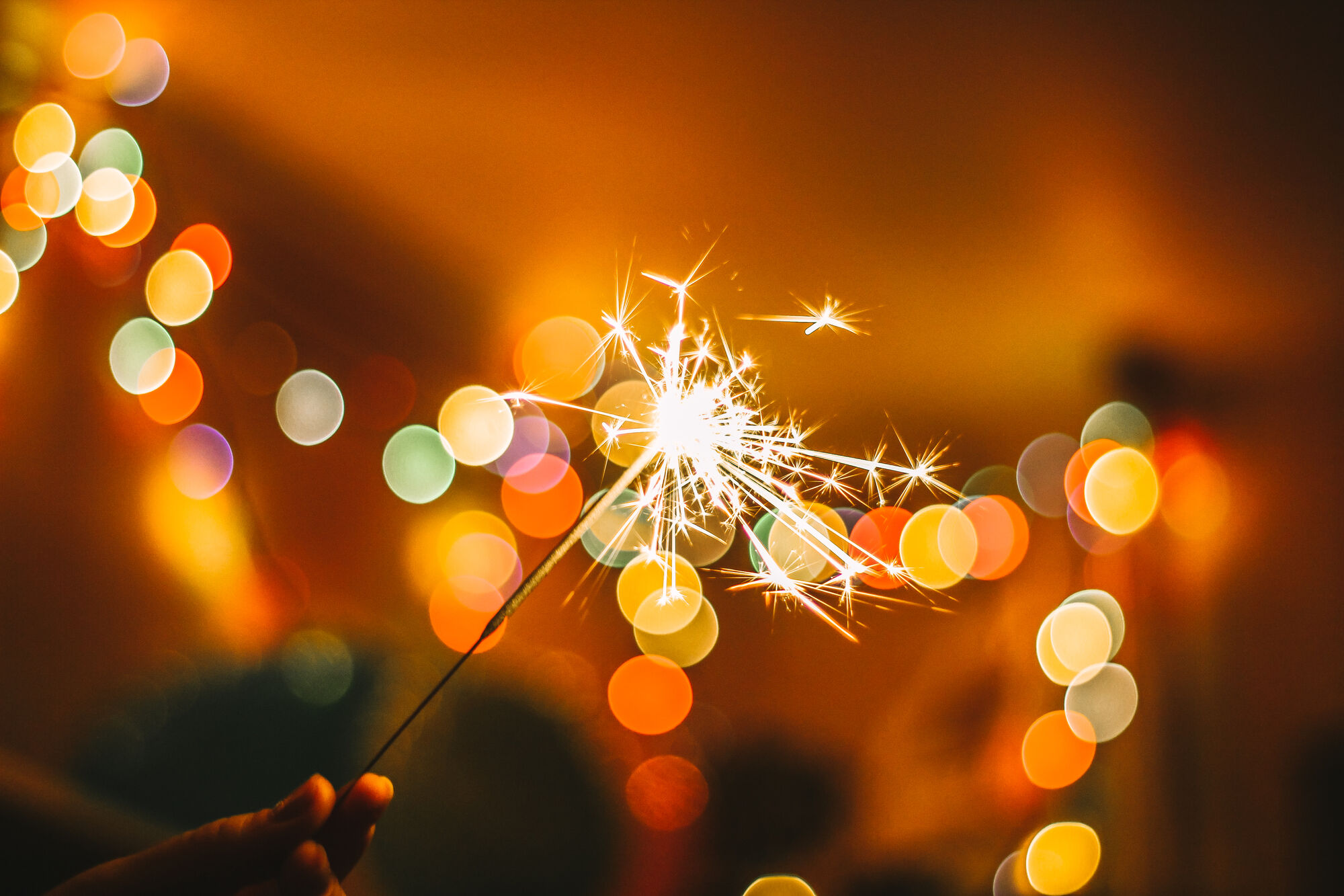 hands holding sparkler